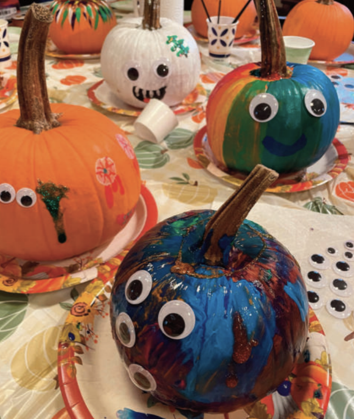 Pumpkins that are painted and decorated.