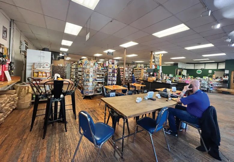 Inside the Green Earth Health Market, there are tables where patrons can work on their laptops and enjoy coffee or a bite to eat. (Photo by Brianna Ferguson)