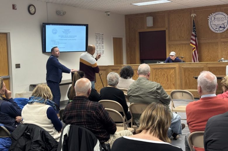 Oneonta Town Councilmember Kim Fierke questions Eco-Yotta officials about their proposal.