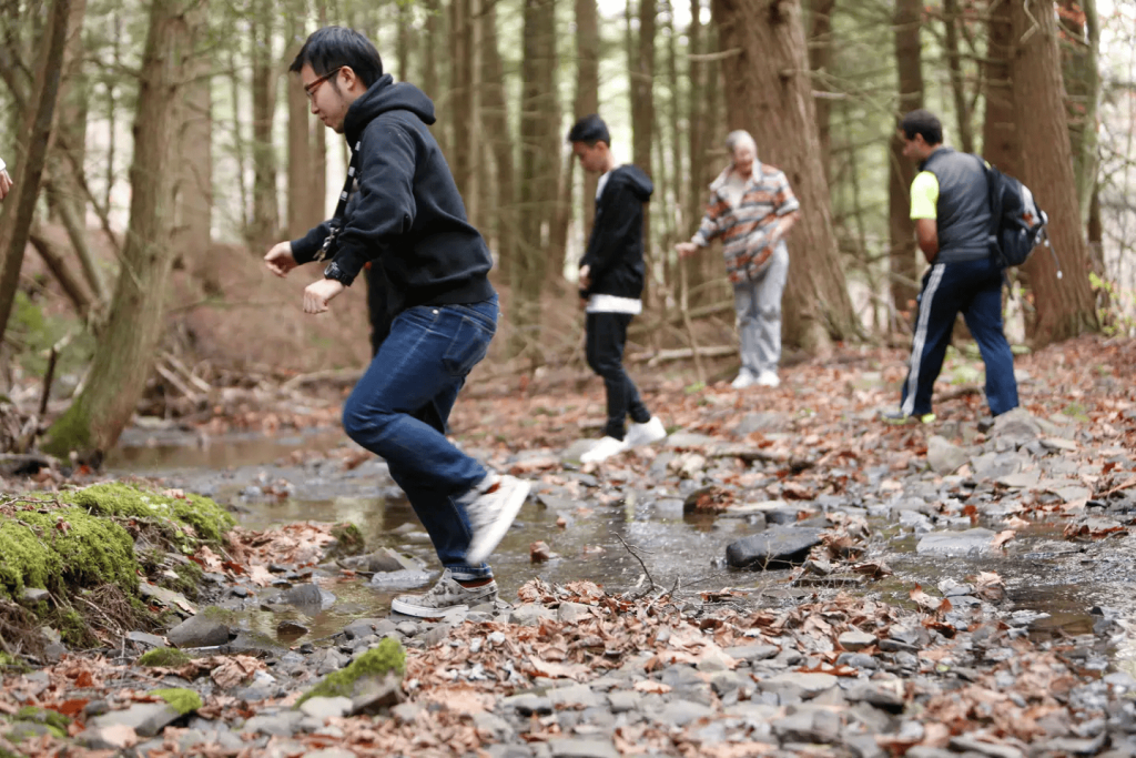 International students hike on the trails at SUNY Oneonta’s College Camp on October 28, 2014.