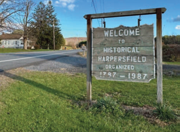 Image of a sign labeled Welcome to Historical Harpers field organized 1787-1987.
