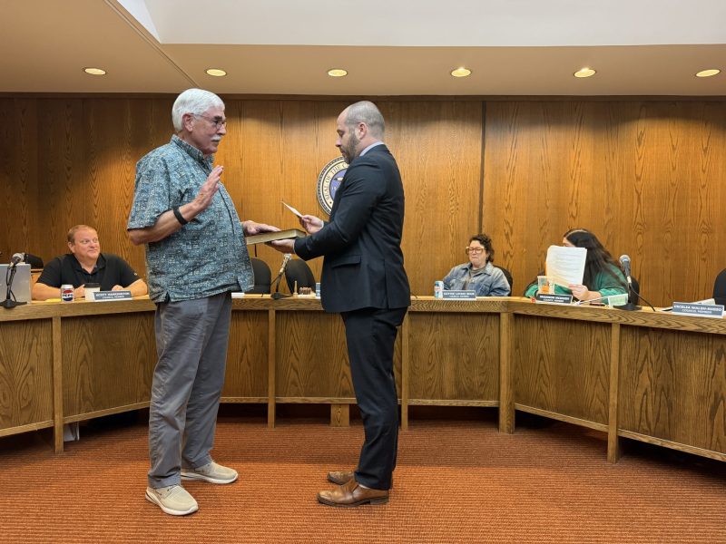 Edward May Jr. getting sworn in by Mayor Dan Buttermann